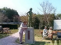 A living nude female Japanese garden statue