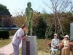 A living nude female Japanese garden statue