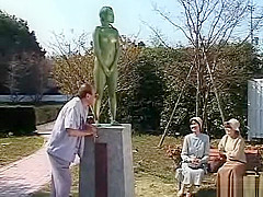A living nude female Japanese garden statue