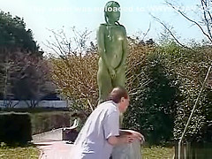 A living nude female Japanese garden statue