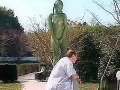 A living nude female Japanese garden statue