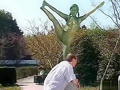 A living nude female Japanese garden statue