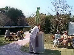A living nude female Japanese garden statue