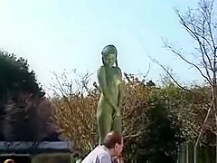 A living nude female Japanese garden statue