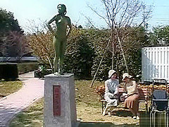 A living nude female Japanese garden statue