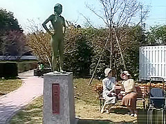 A living nude female Japanese garden statue