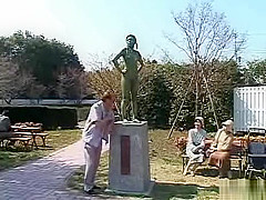 A living nude female Japanese garden statue