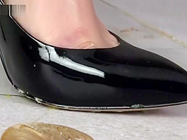 Alisa crushing roaches under her black sexy high heels
