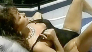 Ashlyn Gere masturbating while lying on sun lounger