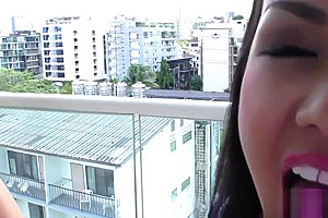 Asian tgirl sucks dildo