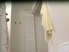 Attractive chick prepares to shower off