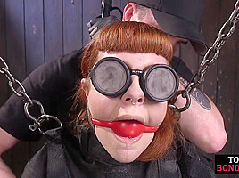 BDSM redhead slut cums hard from dildo stick by master