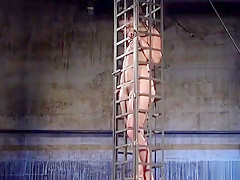 Babe in cage gets water bondage