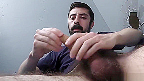 Bearded white man sucking and fucking a black cock at a gloryhole