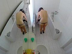 Beautiful housewife removes her clothes in order to wash her juicy holes
