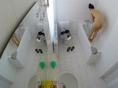 Beautiful housewife removes her clothes in order to wash her juicy holes