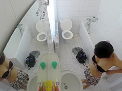 Beautiful housewife removes her clothes in order to wash her juicy holes