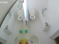 Beautiful housewife removes her clothes in order to wash her juicy holes