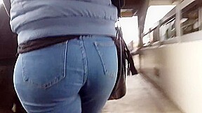 Beautiful lady ass in blue jean walking