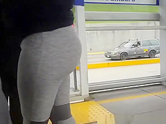 Big ass chick wearing gray leggings