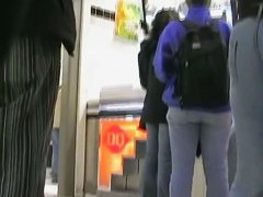 Big booty in blue jeans in a shopping mall candid video