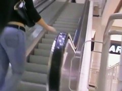 Big booty in blue jeans in a shopping mall candid video