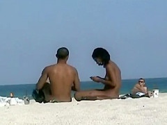 Black girl nude on a beach