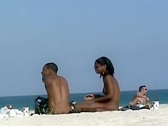 Black girl nude on a beach