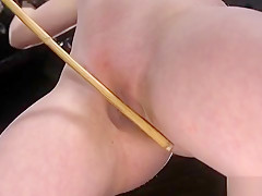 Blindfolded sub whipped in metal fixation