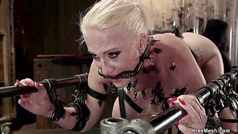 Blonde Slave Strapped In Parallel Bars