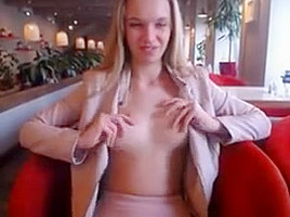 Blonde girl restaurant public play