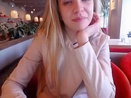 Blonde girl restaurant public play