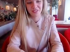 Blonde girl restaurant public play