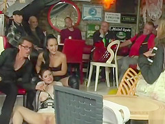 Brunette takes mouthful in public bar