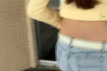 Candid ass wrapped in blue tight jeans caught in the street