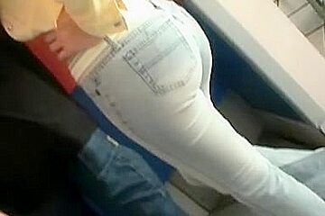 Candid ass wrapped in blue tight jeans caught in the street
