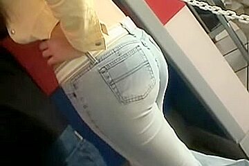 Candid ass wrapped in blue tight jeans caught in the street