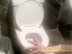 Charming lady with a white hat takes a leak