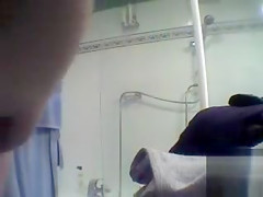 Chubby charmer puts on some clothes after taking a shower