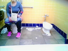 Chubby woman spied in public toilet peeing
