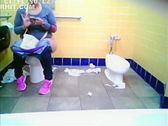 Chubby woman spied in public toilet peeing