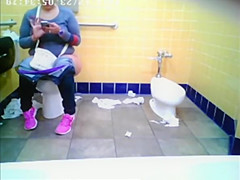 Chubby woman spied in public toilet peeing