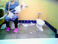Chubby woman spied in public toilet peeing