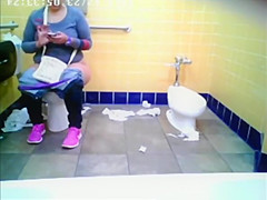 Chubby woman spied in public toilet peeing