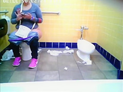 Chubby woman spied in public toilet peeing
