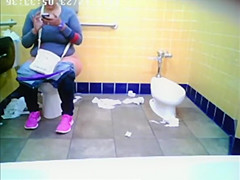 Chubby woman spied in public toilet peeing