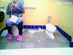 Chubby woman spied in public toilet peeing