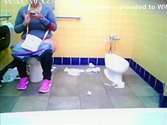 Chubby woman spied in public toilet peeing