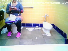Chubby woman spied in public toilet peeing