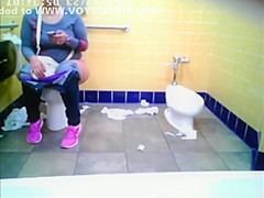 Chubby woman spied in public toilet peeing